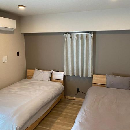 ホテルトーマスとまり Naha Esterno foto