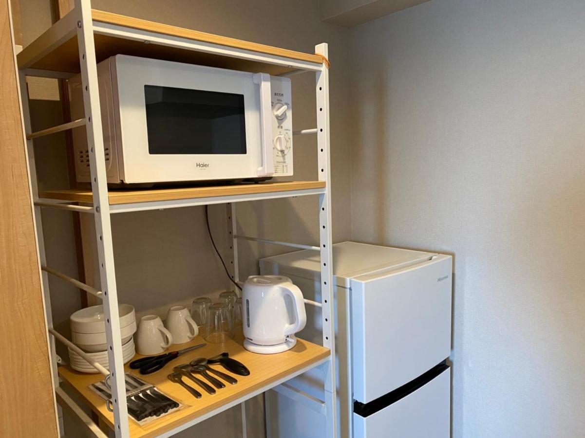 ホテルトーマスとまり Naha Esterno foto